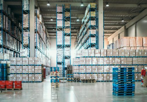 Large warehouse packed with cardboard and plastic boxes