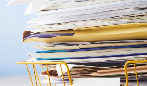 A wire basket being used to store files